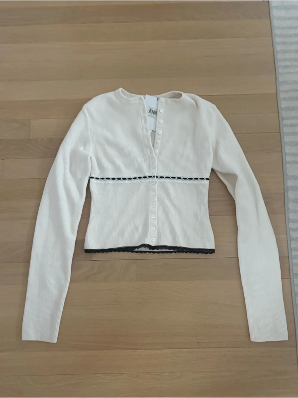 With Jean, Cropped White Ribbed Button-Up Cardigan with Black Trim - Picture 2 of 4